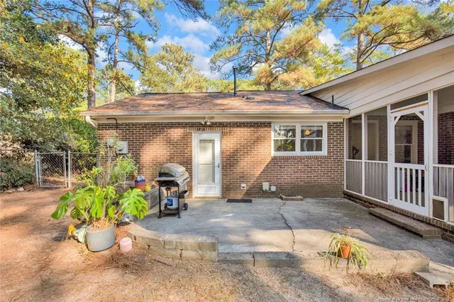 a view of a chair and table in the patio