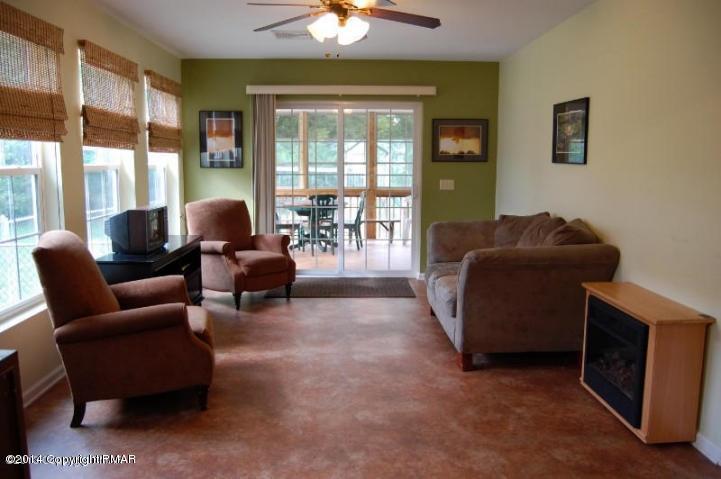 117 Michaels Run Road Stroudsburg, PA 18360 - Photo 11 of 15 a living room with furniture and a floor to ceiling window