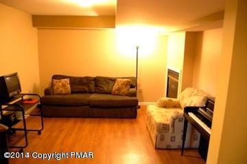 117 Michaels Run Road Stroudsburg, PA 18360 - Photo 12 of 15 a living room with furniture and a flat screen tv