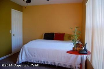 117 Michaels Run Road Stroudsburg, PA 18360 - Photo 13 of 15 a bedroom with a bed and a dresser