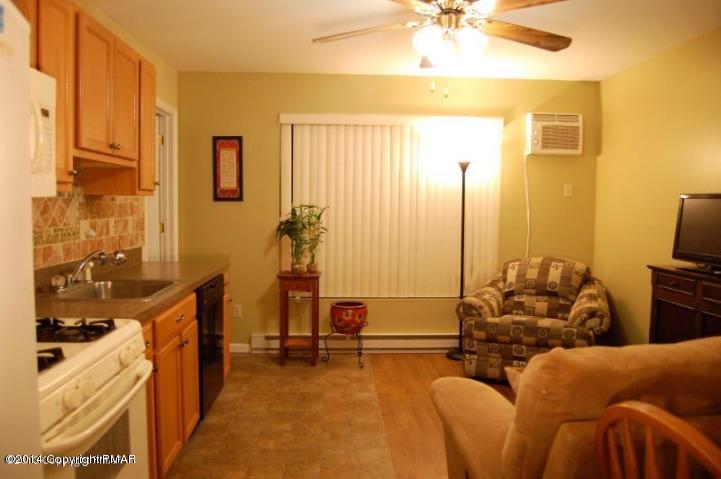 117 Michaels Run Road Stroudsburg, PA 18360 - Photo 4 of 15 a living room with furniture and a flat screen tv