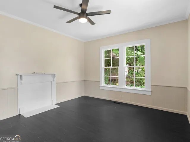 an empty room with a empty space and a window