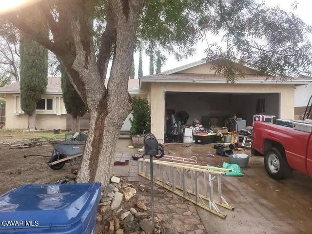 a view of car parked in front of house