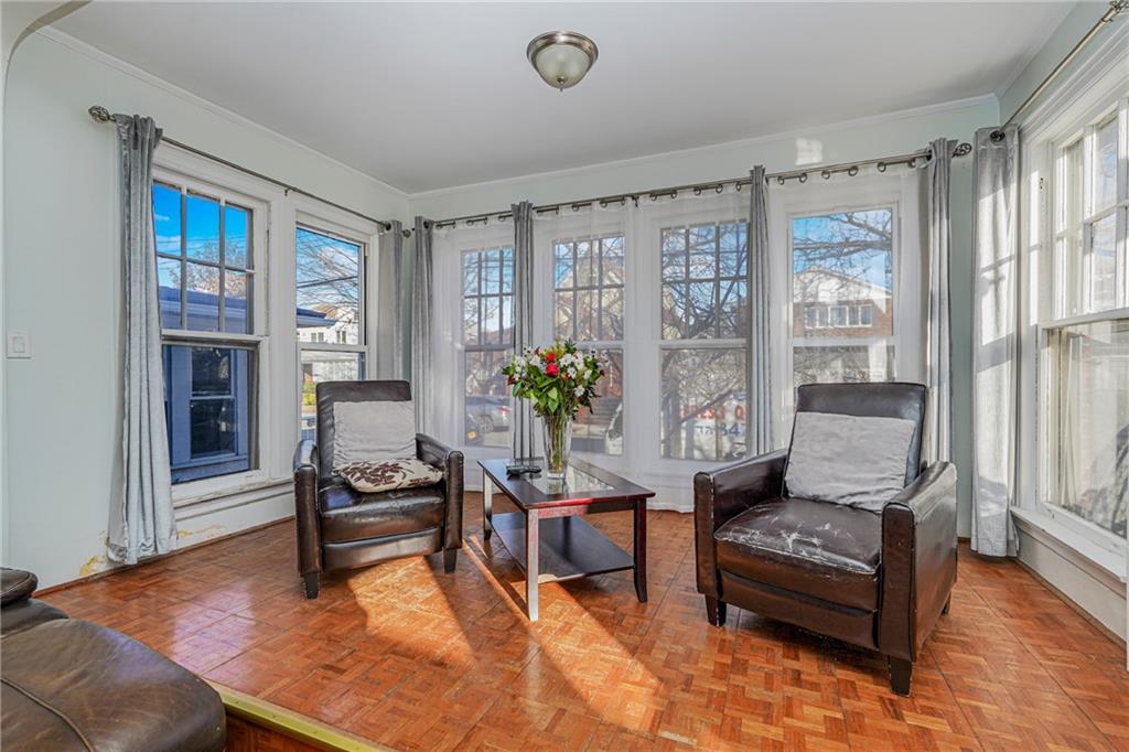 1764 East 24th Street Brooklyn, NY 11229 - Photo 4 of 16 a living room with furniture and wooden floor