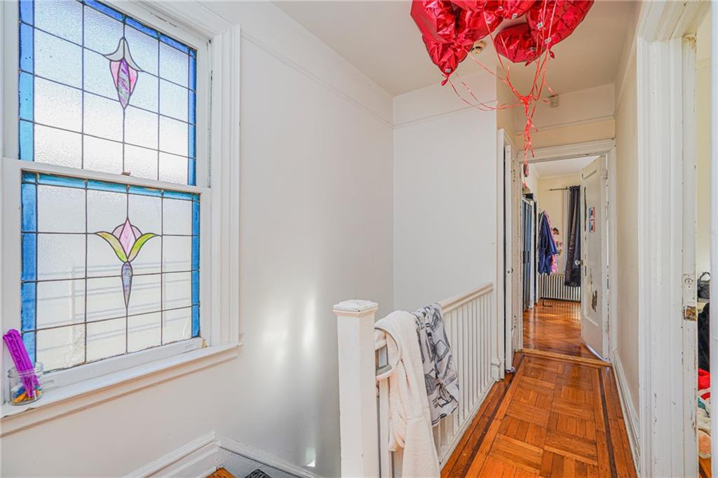 1764 East 24th Street Brooklyn, NY 11229 - Photo 7 of 16 a view of a hallway with wooden floor and entryway