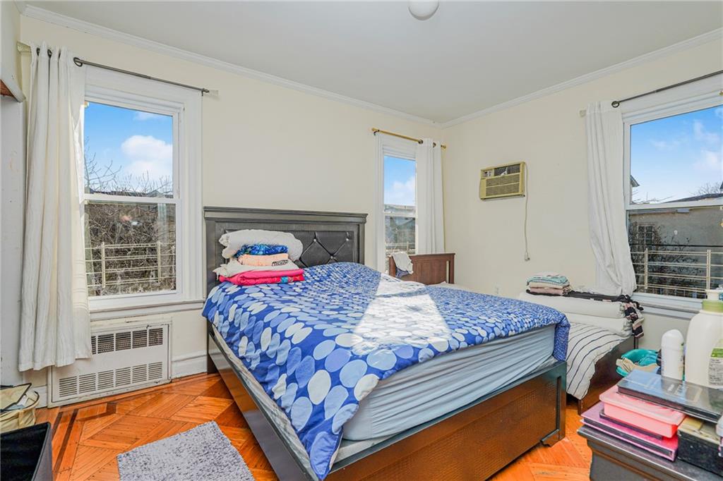 1764 East 24th Street Brooklyn, NY 11229 - Photo 8 of 16 a bedroom with a bed and balcony