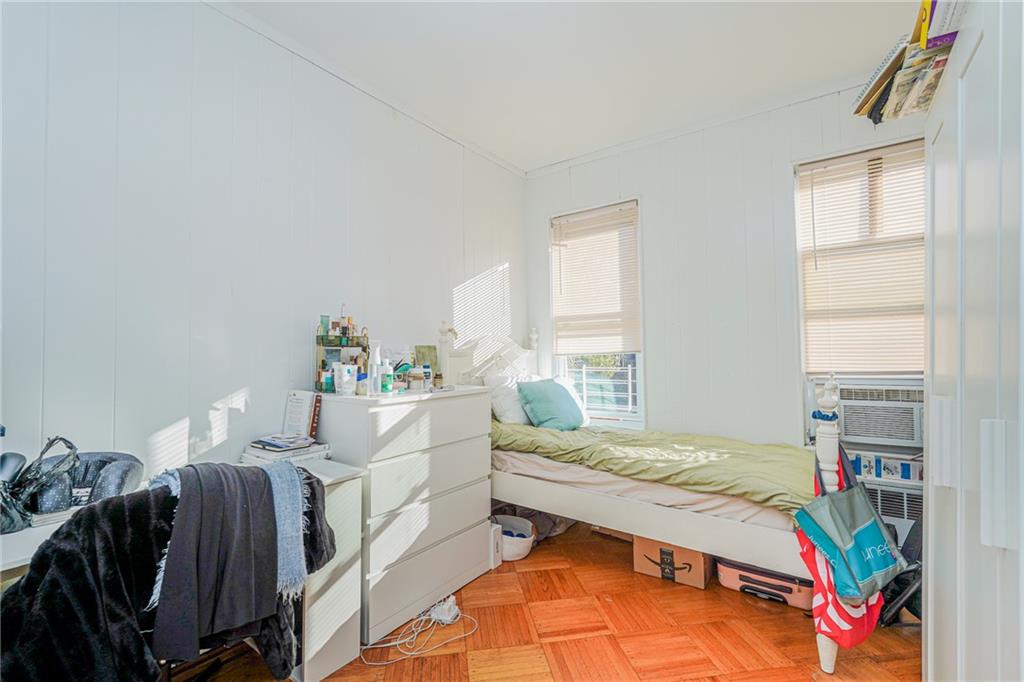 1764 East 24th Street Brooklyn, NY 11229 - Photo 10 of 16 a bedroom with a bed and a window
