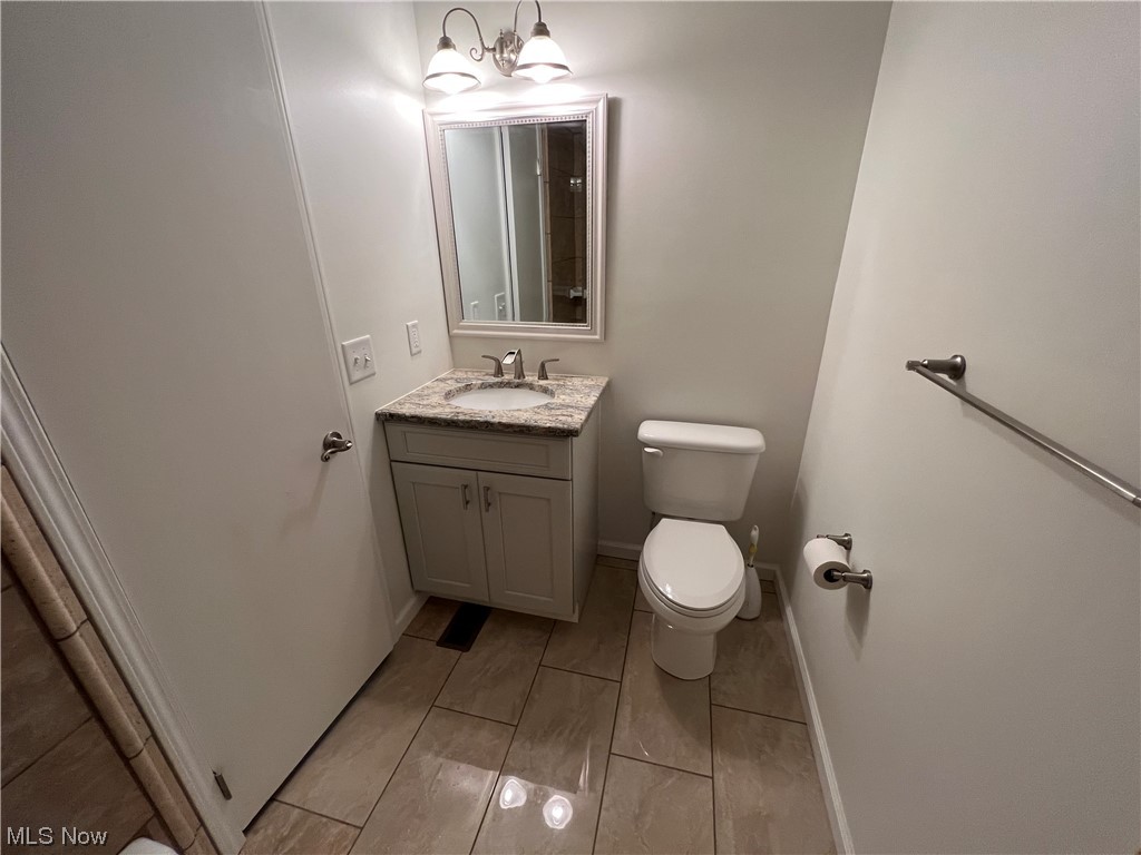 5105 Hillside Road Independence, OH 44131 - Photo 26 of 35 Bathroom with a chandelier, toilet, and vanity