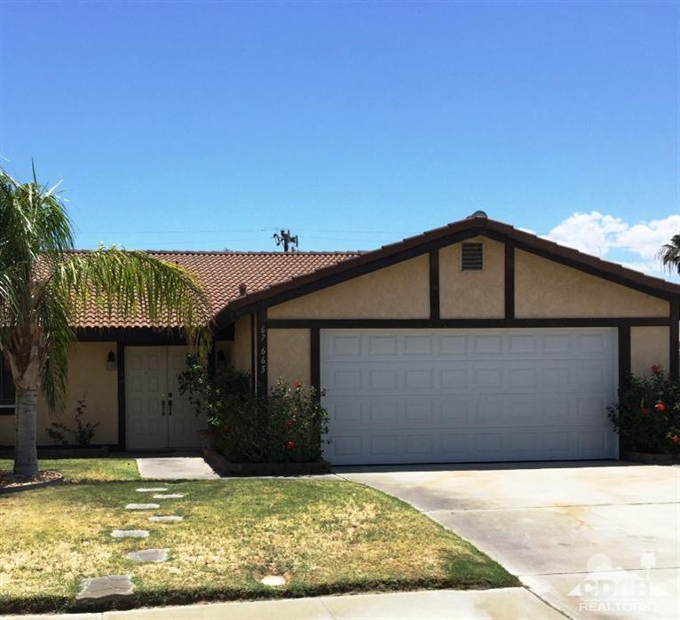 67665 Paletero Road Cathedral City, CA 92234 - Photo 1 of 18 a view of a house with swimming pool