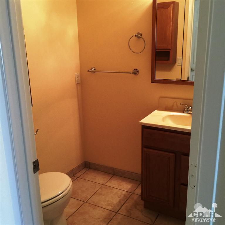 67665 Paletero Road Cathedral City, CA 92234 - Photo 11 of 18 a bathroom with a sink and a toilet