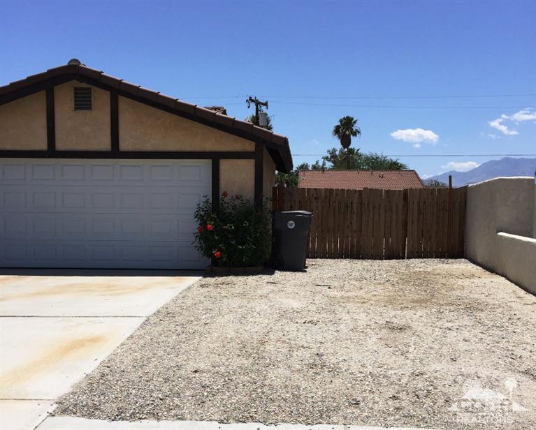 67665 Paletero Road Cathedral City, CA 92234 - Photo 2 of 18 a front view of a house with a yard