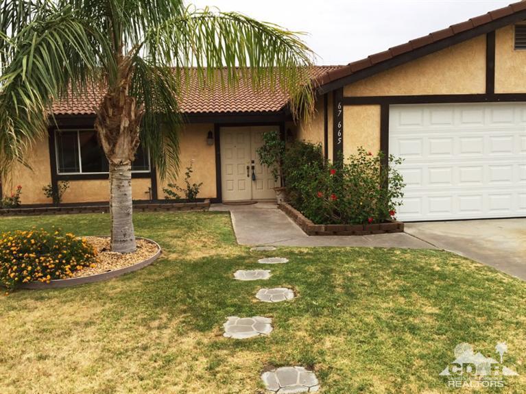 67665 Paletero Road Cathedral City, CA 92234 - Photo 4 of 18 a front view of a house with garden