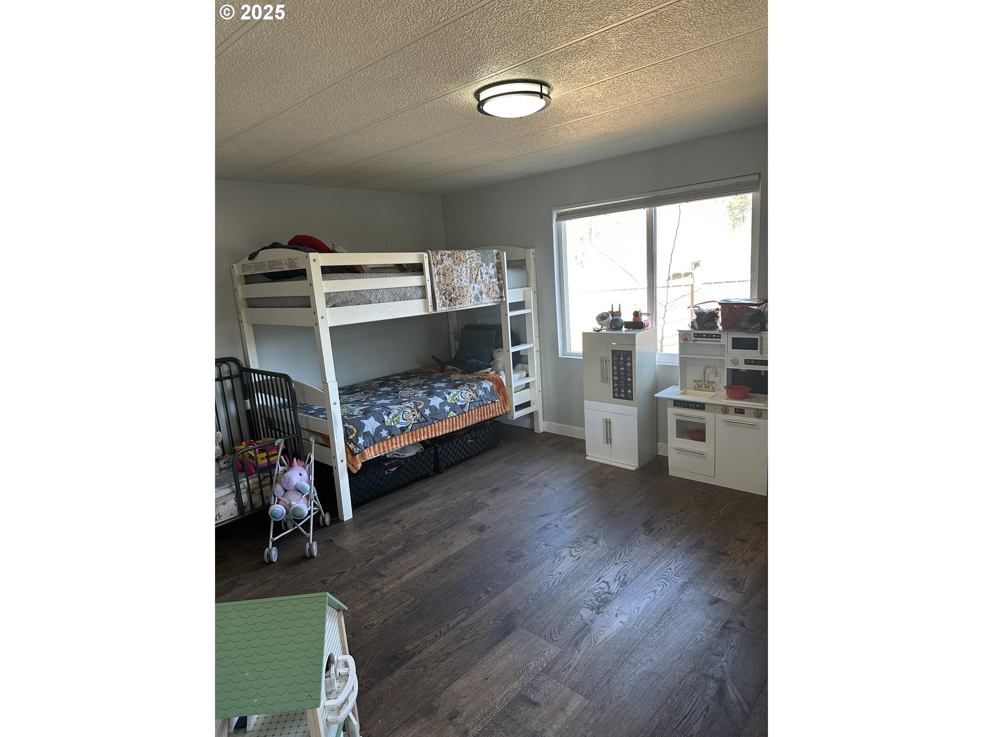 136010 Hwy 97 Crescent Crescent, OR 97733 - Photo 12 of 43 a bedroom with furniture and a window