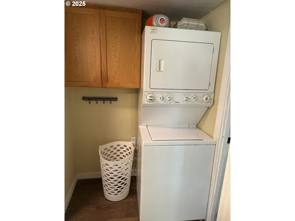 a close up of a utility room with dryer and washer