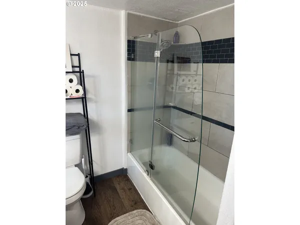 a bathroom with a bathtub and a shower
