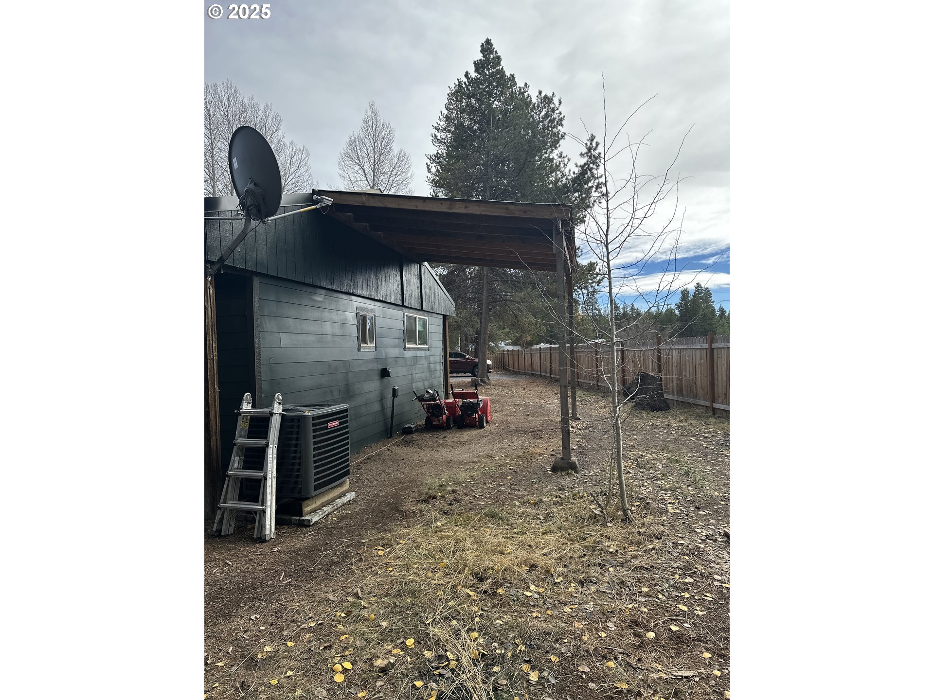 136010 Hwy 97 Crescent Crescent, OR 97733 - Photo 32 of 43 a backyard of a house with barbeque oven and brick wall