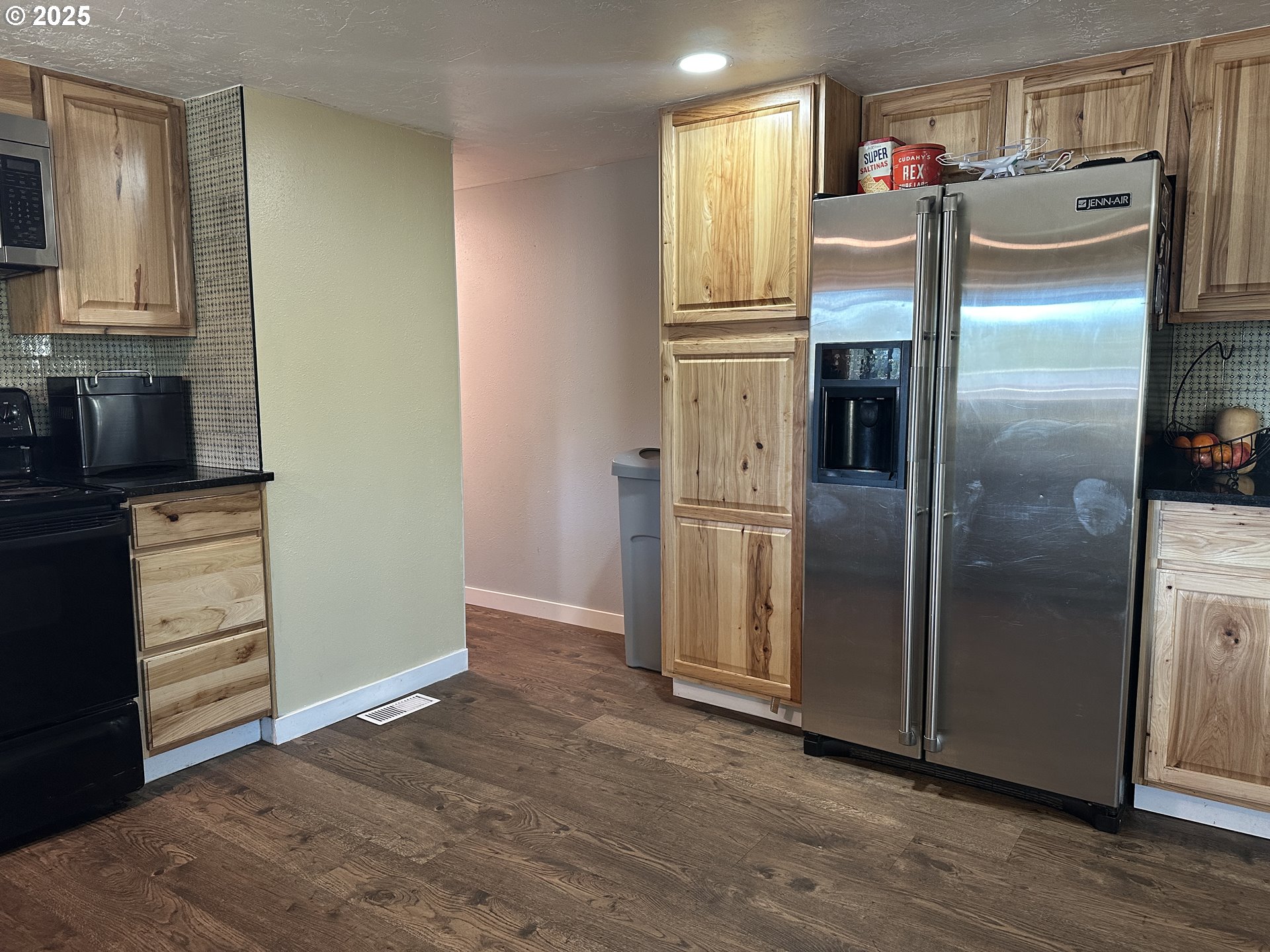 136010 Hwy 97 Crescent Crescent, OR 97733 - Photo 6 of 43 a kitchen with a refrigerator and cabinets