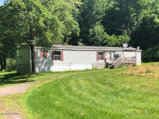213 Slish Road Honesdale, PA 18431 - Photo 2 of 13 a view of a house with backyard and a tree