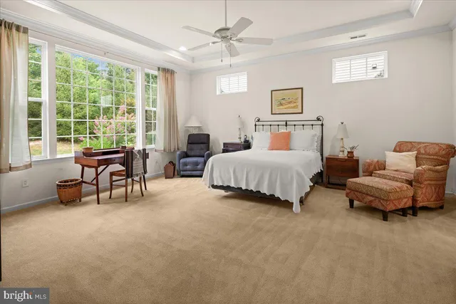 a bedroom with a bed and a chair