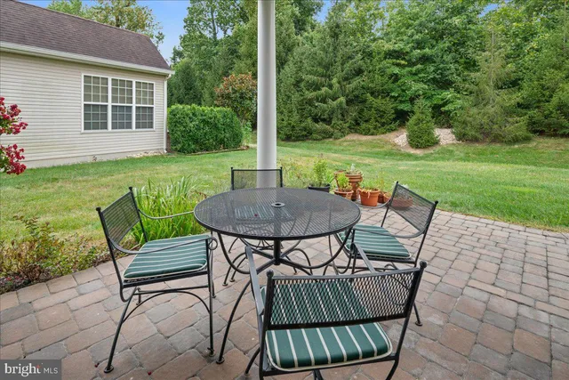 a front view of a house with a garden and yard