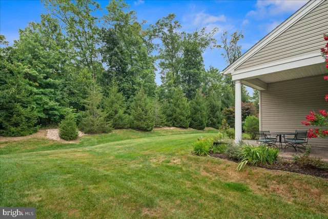 an aerial view of a house with a garden and outdoor space