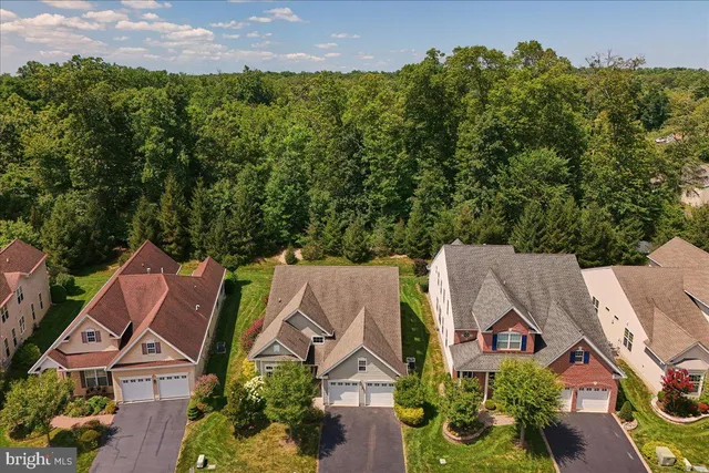 an aerial view of a house outdoor space and street view