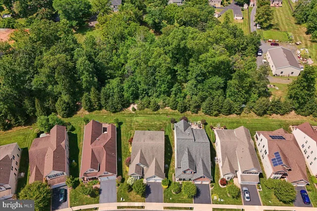 an aerial view of a house with a garden