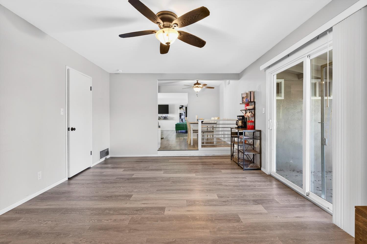 2337 Corbin Lane Lodi, CA 95242 - Photo 18 of 34 a view of a livingroom with a furniture chandelier fan and a hardwood floor