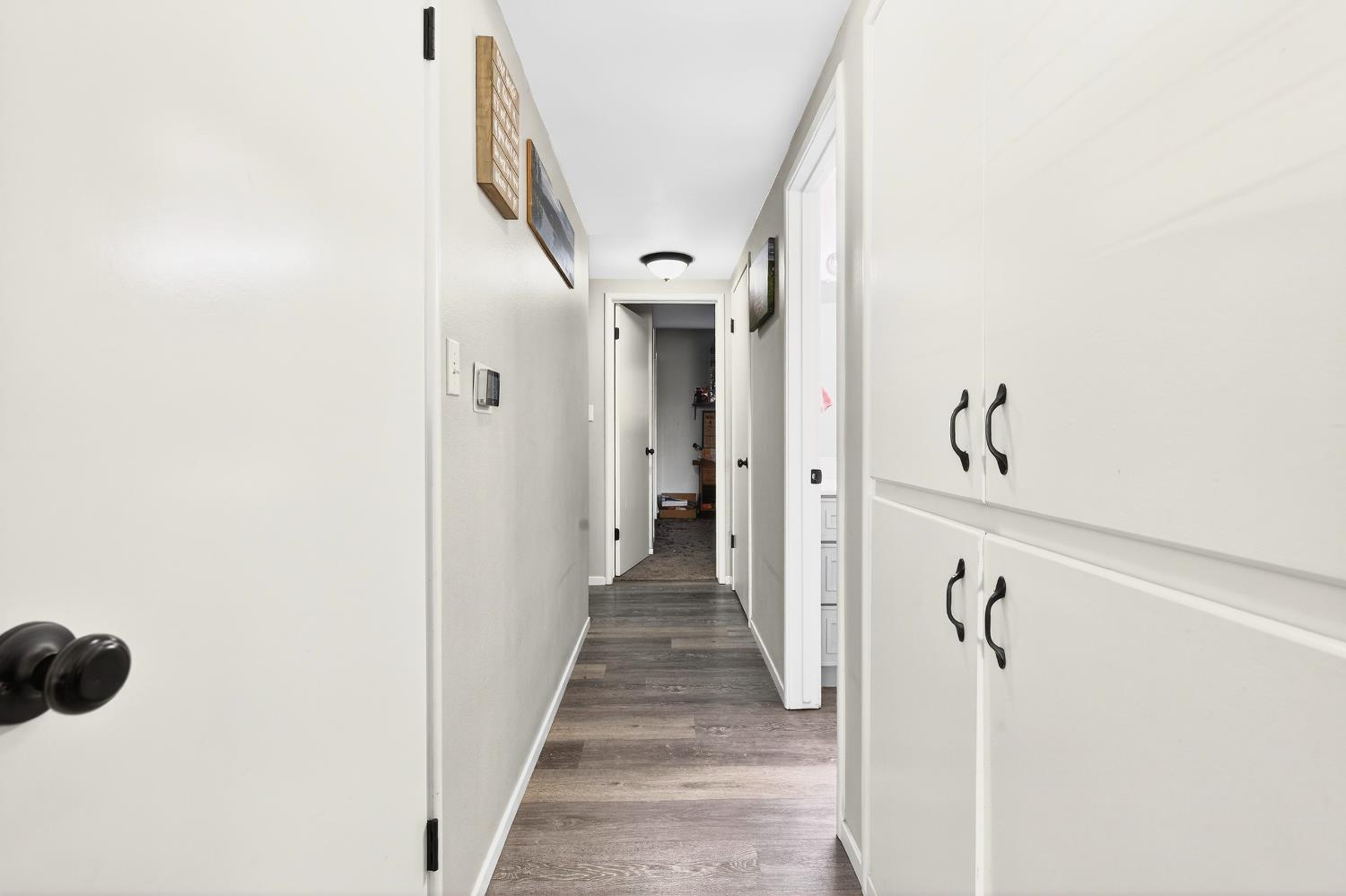 2337 Corbin Lane Lodi, CA 95242 - Photo 20 of 34 a view of a hallway with wooden floor and staircase