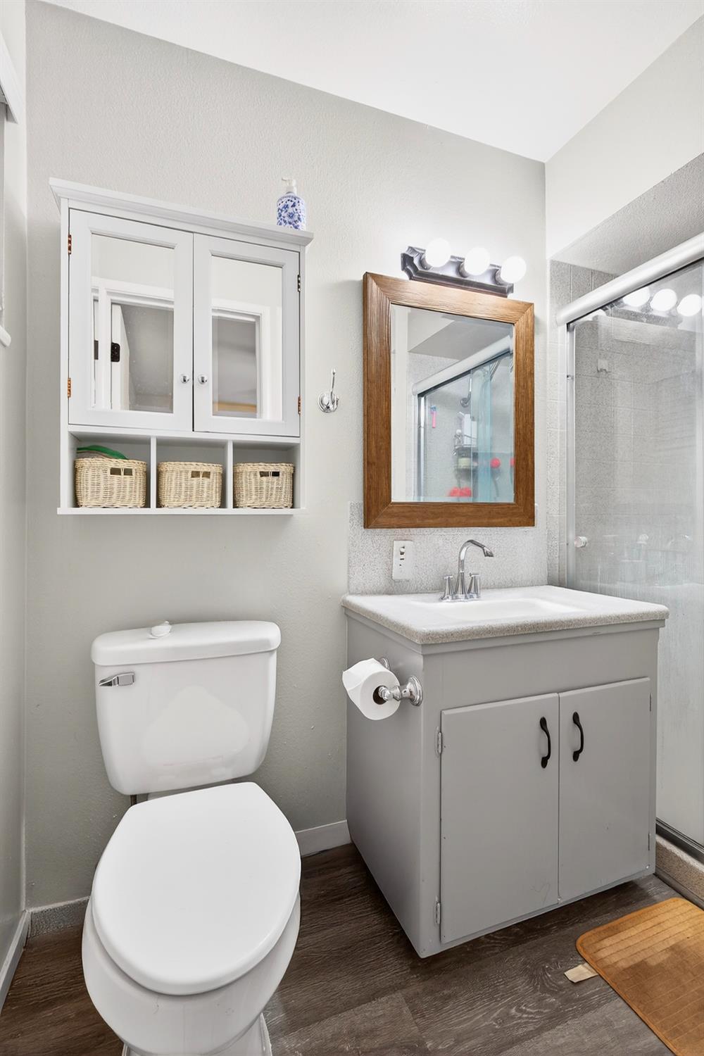 2337 Corbin Lane Lodi, CA 95242 - Photo 25 of 34 a bathroom with a toilet sink and mirror