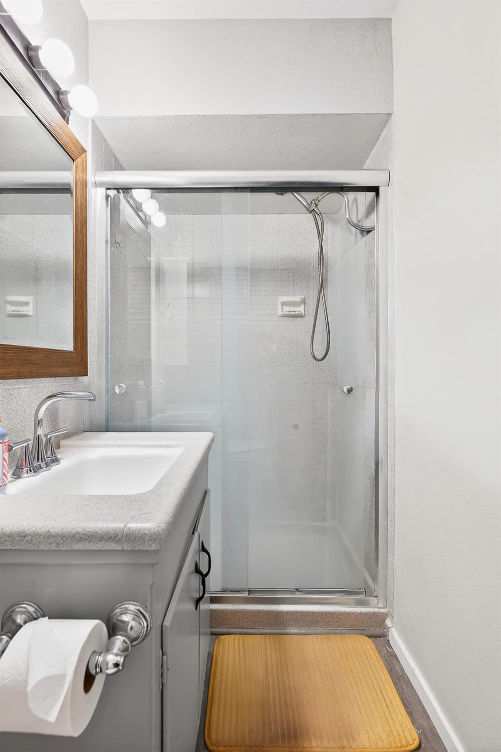 2337 Corbin Lane Lodi, CA 95242 - Photo 26 of 34 a bathroom with a granite countertop sink mirror and shower