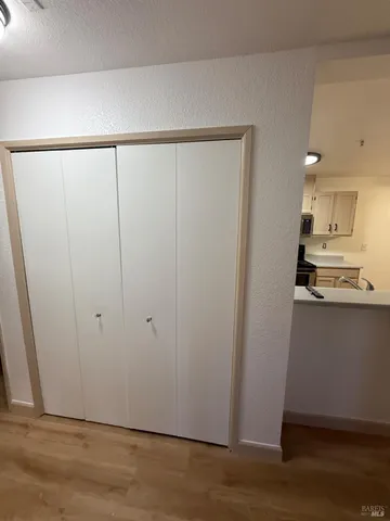 a view of a kitchen with wooden floor