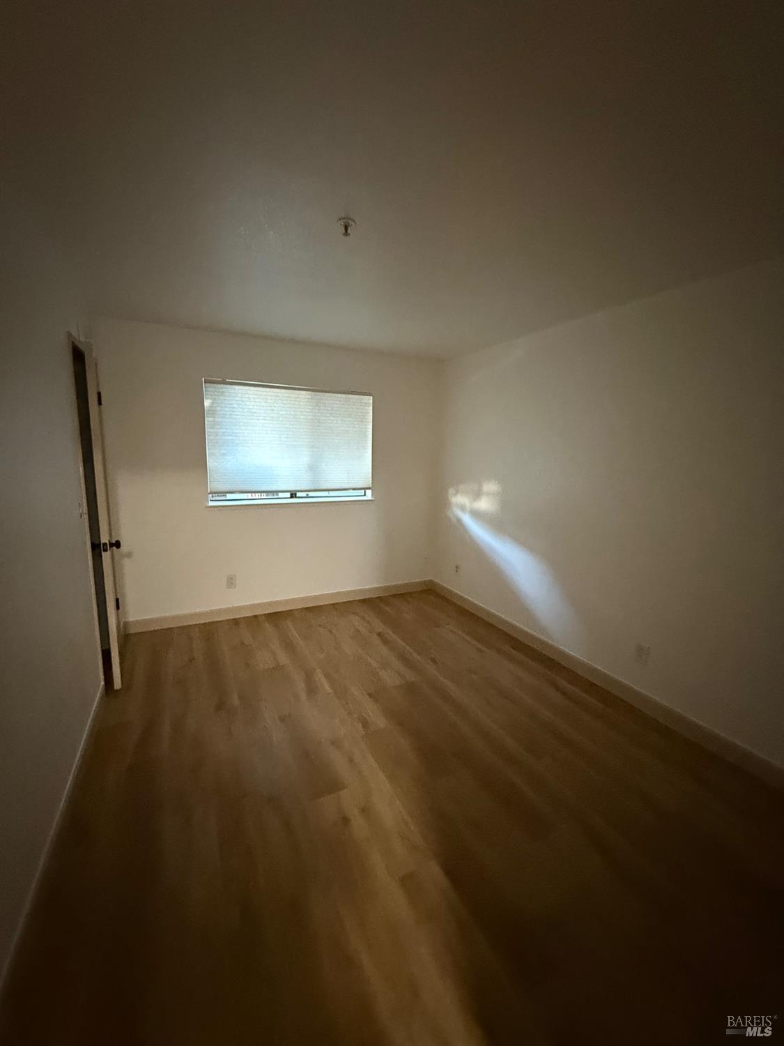 136 Sea Crest Circle Vallejo, CA 94590 - Photo 12 of 29 a view of empty room with wooden floor and fan