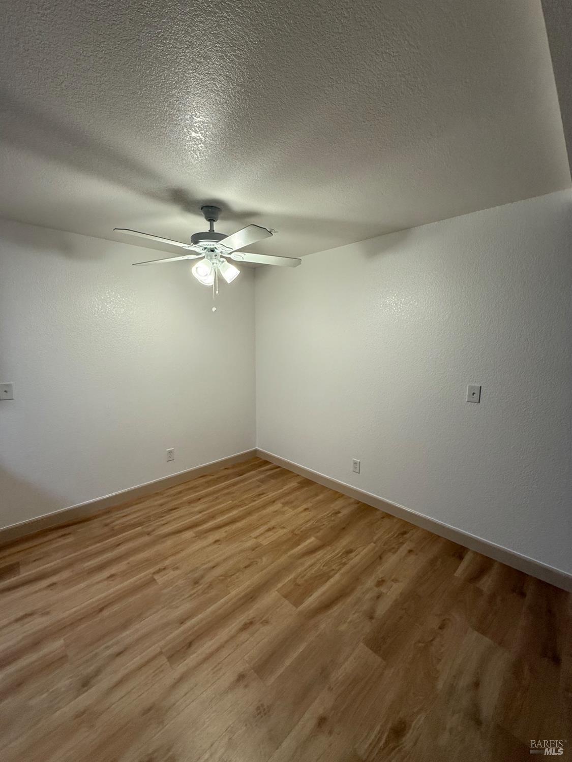 136 Sea Crest Circle Vallejo, CA 94590 - Photo 13 of 29 a view of a room with wooden floor and ceiling fan