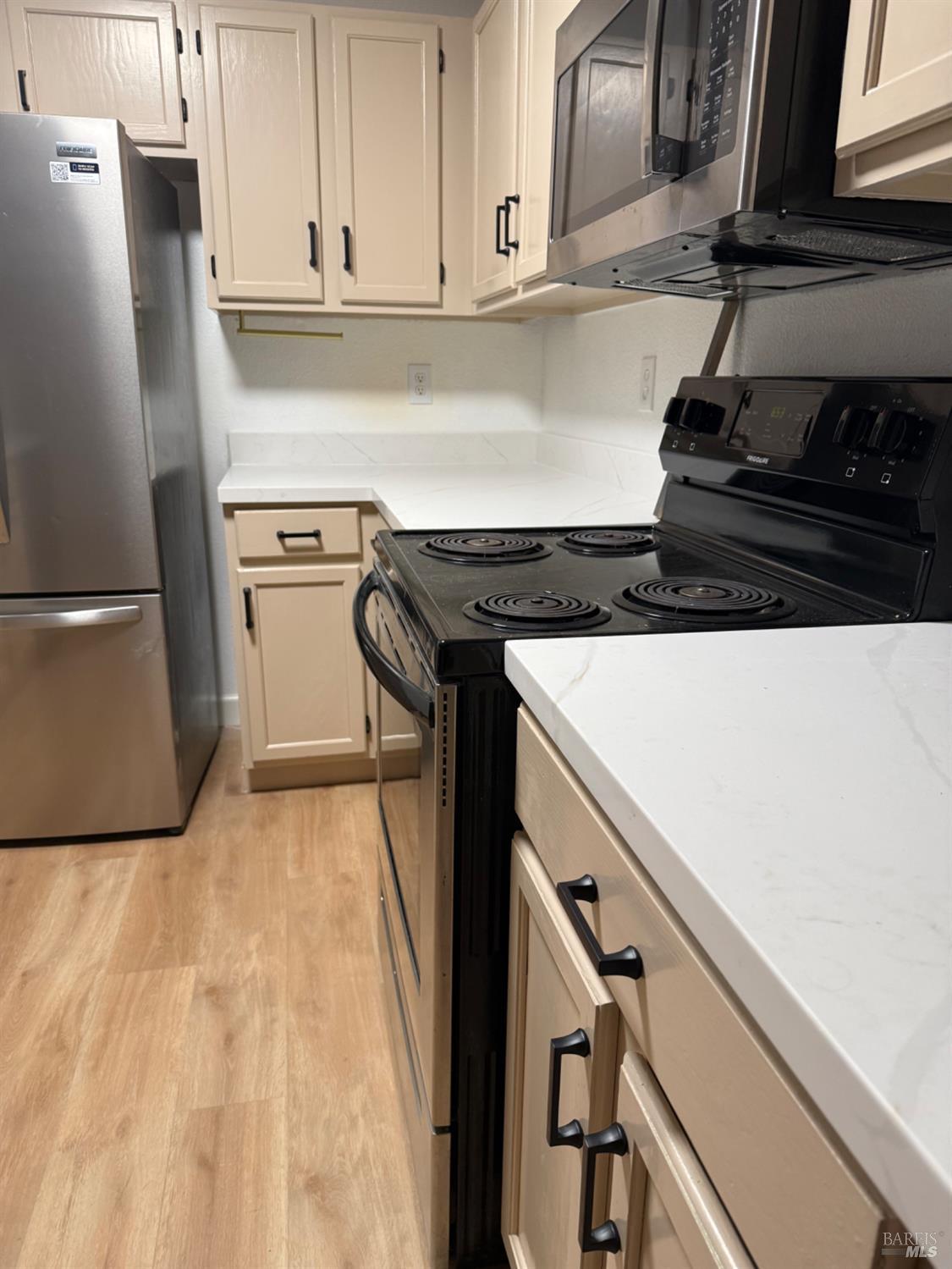 136 Sea Crest Circle Vallejo, CA 94590 - Photo 28 of 29 a kitchen with a stove and a refrigerator