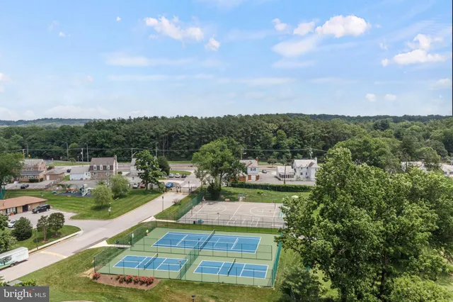 a childrens park with lots of swings and slides