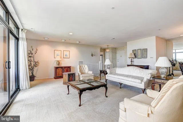 a spacious bedroom with a bed and window