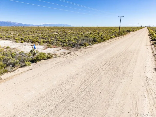 a view of an ocean beach and mountain