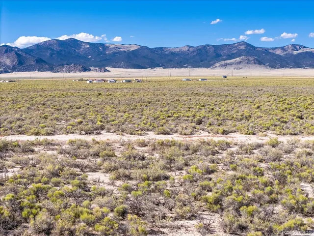 a view of an ocean and a mountain