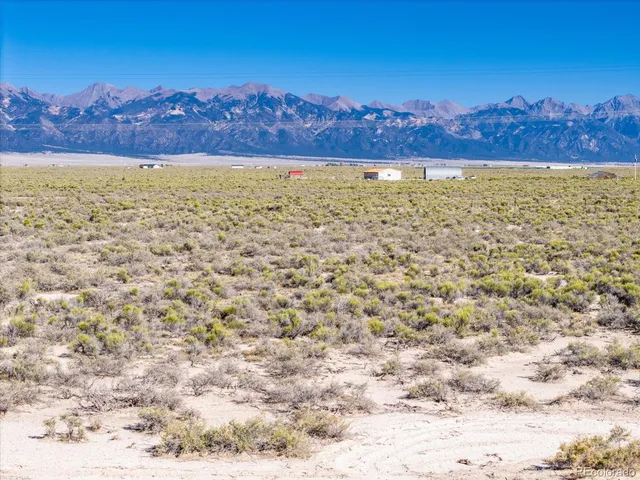 a view of an ocean beach and mountain