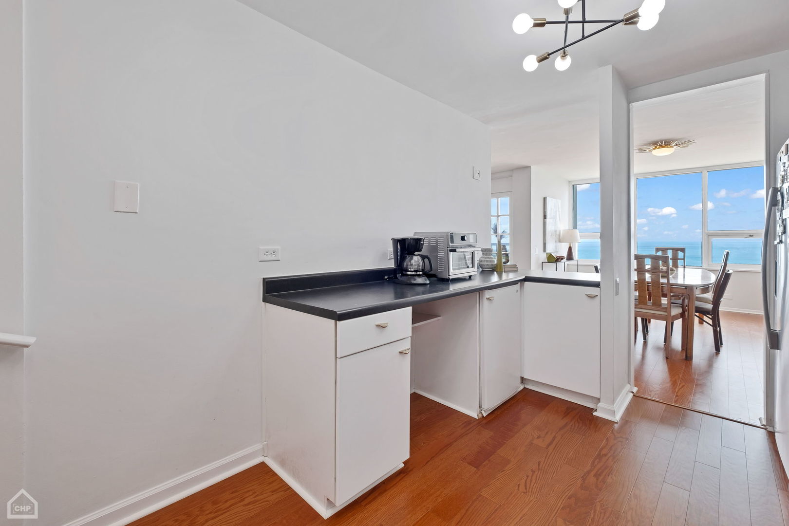 5733 North Sheridan Road, Unit 25C Chicago, IL 60660 - Photo 13 of 39 a kitchen with a sink and cabinets