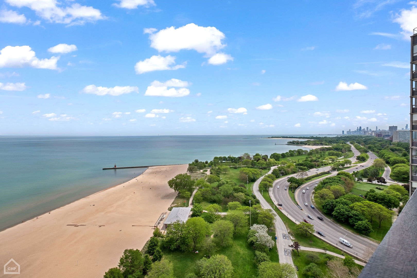 5733 North Sheridan Road, Unit 25C Chicago, IL 60660 - Photo 9 of 39 a view of a lake with a yard