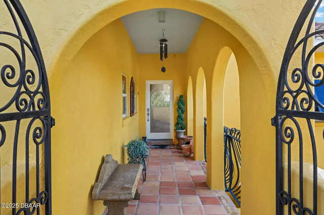 a living room with furniture a flat screen tv and a large window