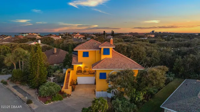 an aerial view of a house with a garden