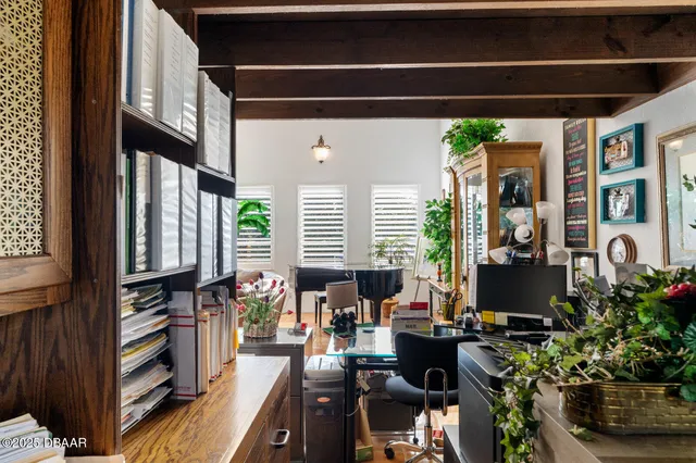 a lobby with furniture and chandelier