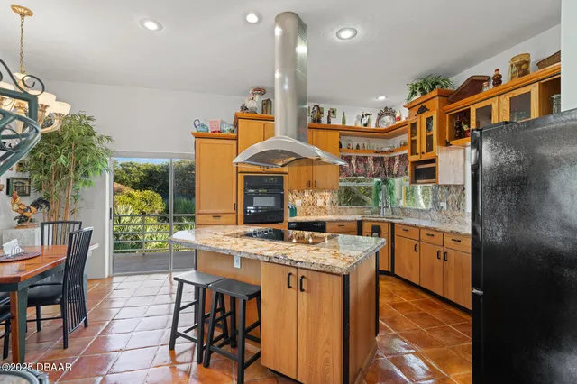 a bedroom with furniture and a chandelier