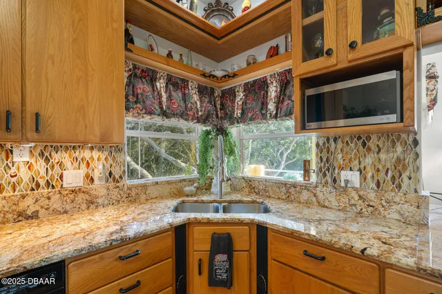 a work room with furniture and a flat screen tv