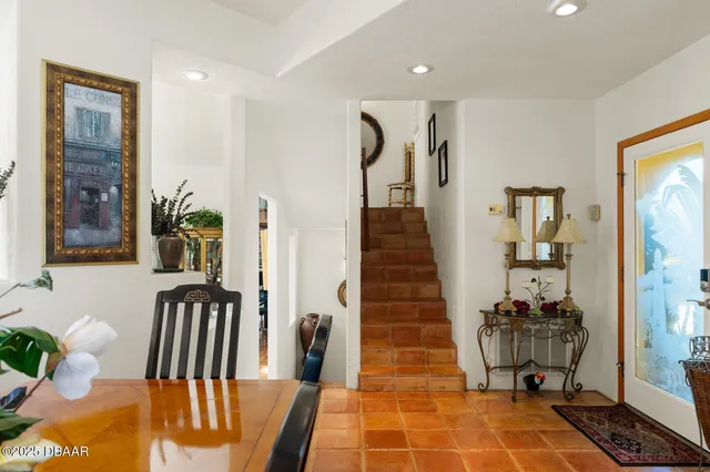 a bathroom with a granite countertop sink a toilet a mirror and shower