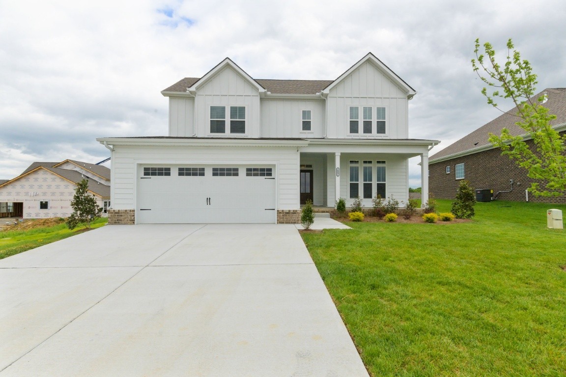 404 Butler Road Mount Juliet, TN 37122 - Photo 1 of 23 a front view of a house with a yard and potted plants