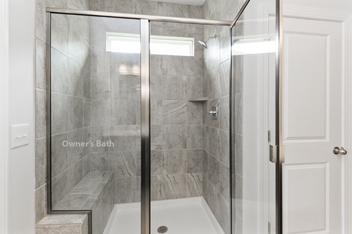 404 Butler Road Mount Juliet, TN 37122 - Photo 14 of 23 a bathroom with a glass shower door